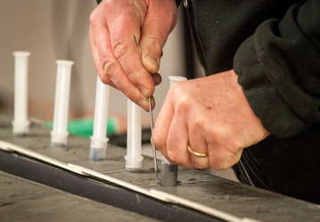 Taking syringe samples from a sediment core