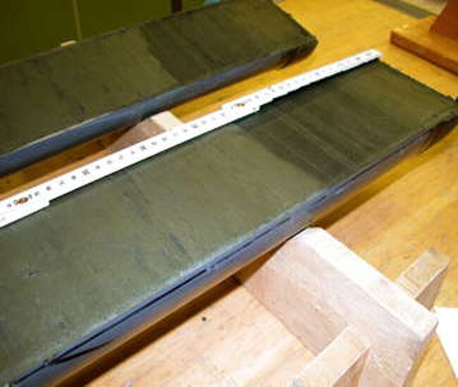 Sediment core with a dark tephra layer