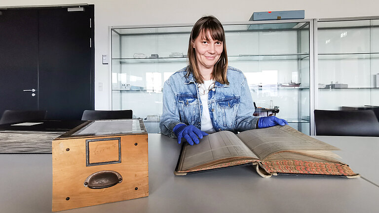 Dr Ulrike Heine looks at the inventory book of the German Atlantic Expedition from the DSM collection. 