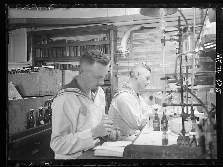 Titrating water samples onboard research vessel METEOR I at sea.