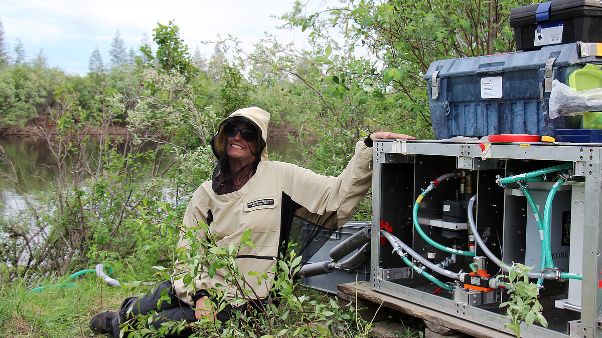 Anna Canning sitting next to her instruments
