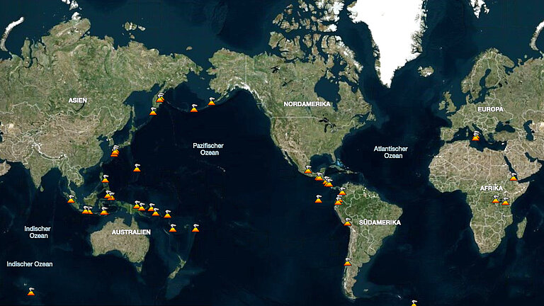 A world map with orange dots indicating volcanoes